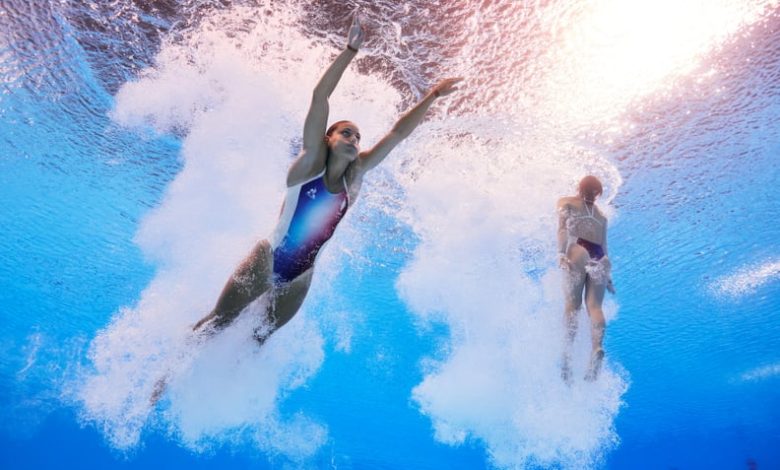 PARIS, FRANCE - JULY 27: (EDITORS NOTE: Image was captured using an underwater robotic camera.) Nais Gillet and Juliette Landi of Team France compete in the Women's Synchronised 3m Springboard Final on day one of the Olympic Games Paris 2024 at Aquatics C