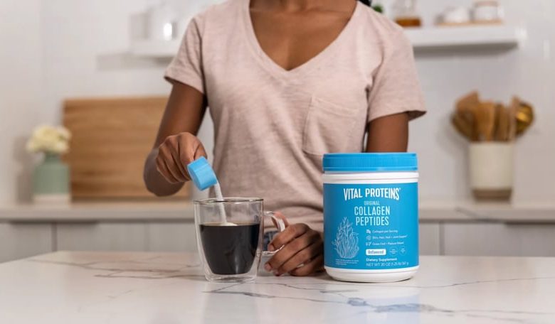 Woman pouring Vital Proteins Collagen Peptides Powder into coffee cup.