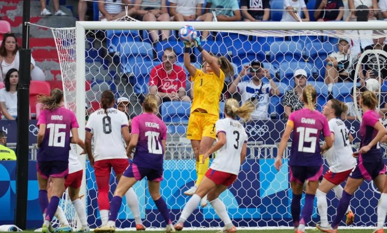 LYON, FRANCE - AUGUST 06: Alyssa Naeher #1 of the United States punches the ball clear during extra time against Germany during the Women's semifinal match during the Olympic Games Paris 2024 at Stade de Lyon on August 06, 2024 in Lyon, France. (Photo by