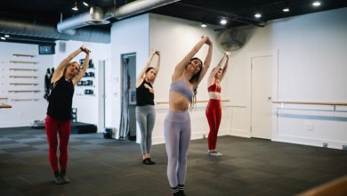 Group of women exercising at a barre class in a gym in Santa Monica, Los Angeles.