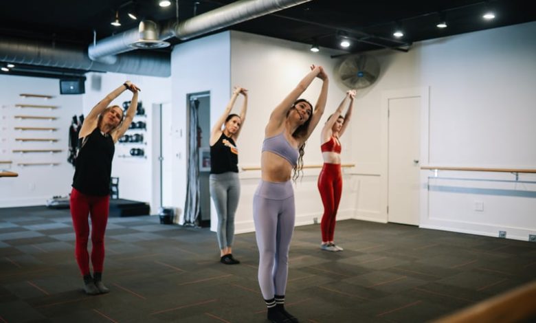 Group of women exercising at a barre class in a gym in Santa Monica, Los Angeles.