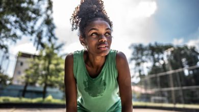 Tired young woman in a sports court