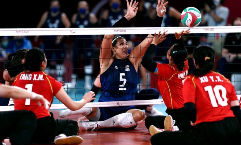 TOKYO, JAPAN - SEPTEMBER 05:  Kathryn Holloway of Team United States and Yanan Wang of Team China go for the ball during the Women's Sitting Volleyball gold match between and China and USA on day 12 of the Tokyo 2020 Paralympic Games at Makuhari Messe Hal