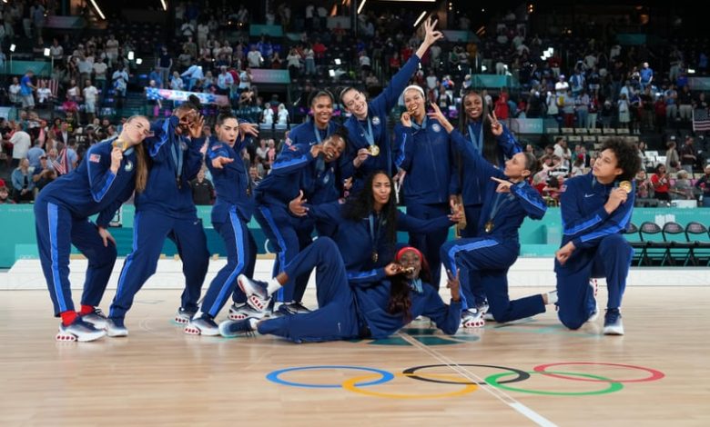 PARIS, FRANCE - AUGUST 11: The USA Women's National Team poses for a photo after winning the Women's Gold Medal Game on August 11, 2024 at the AccorHotels Arena in Paris, France. NOTE TO USER: User expressly acknowledges and agrees that, by downloading an