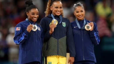 PARIS, FRANCE - AUGUST 05: Gold medalist Rebeca Andrade (C) of Team Brazil, silver medalist Simone Biles (L) of Team United States and bronze medalist Jordan Chiles (R) of Team United States pose on the podium at the Artistic Gymnastics Women's Floor Exer