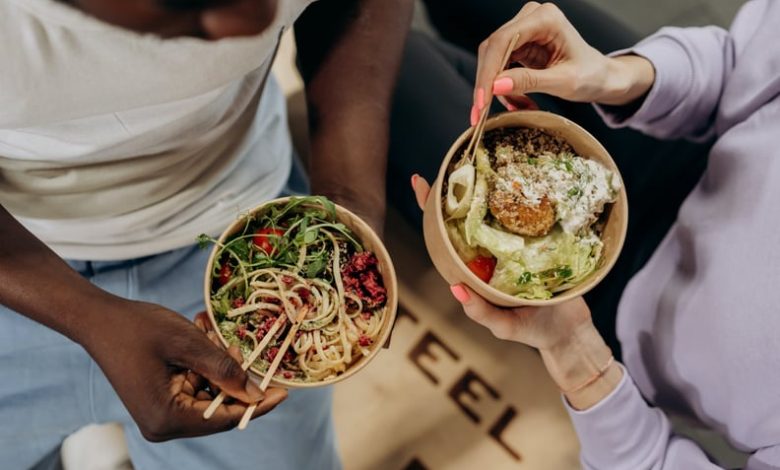 two people eating colorful bowls of food to signify hormone balancing trend on TikTok