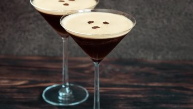 Two espresso martini cocktails garnished with coffee beans.