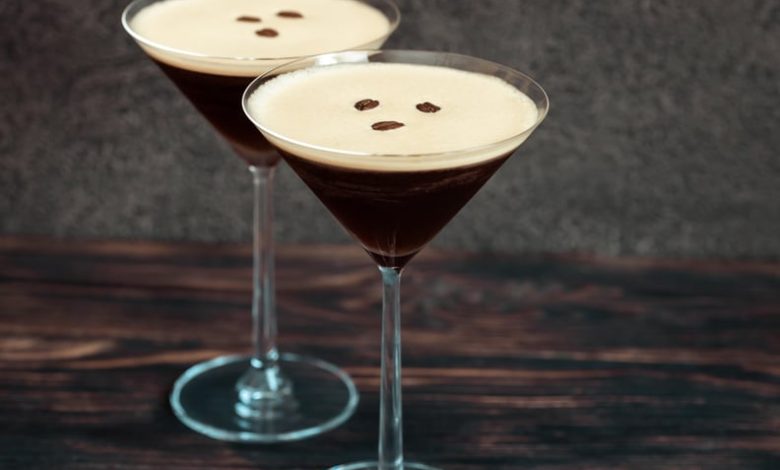 Two espresso martini cocktails garnished with coffee beans.