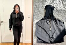 Woman wearing the Lululemon Scuba Oversized Half-Zip Hoodie and the Lululemon Scuba Oversized Half-Zip Hoodie on bed.