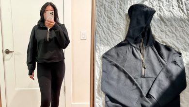 Woman wearing the Lululemon Scuba Oversized Half-Zip Hoodie and the Lululemon Scuba Oversized Half-Zip Hoodie on bed.